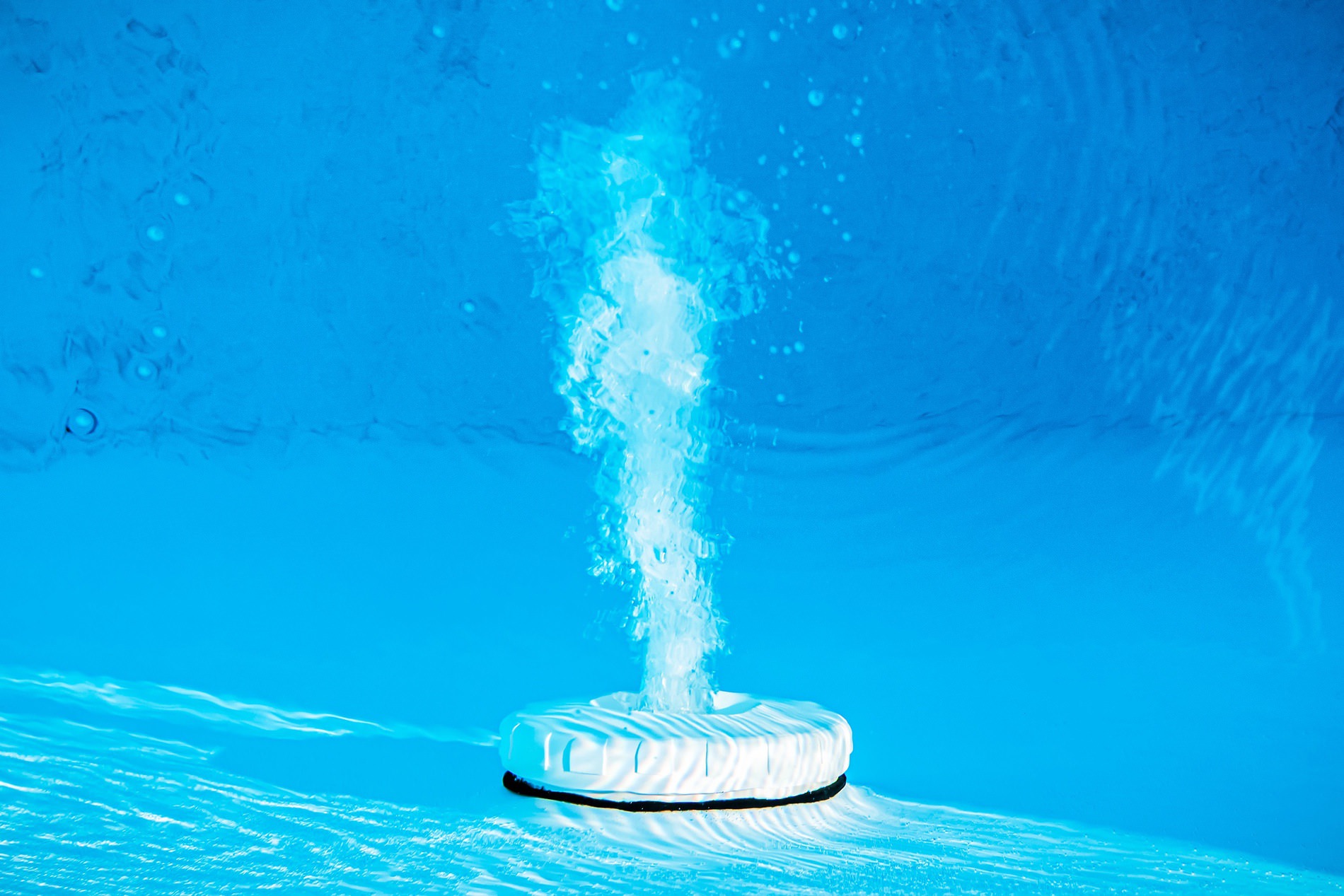 Underwater pool chlorine tablet dissolving in residential swimming pool in Brentwood CA
