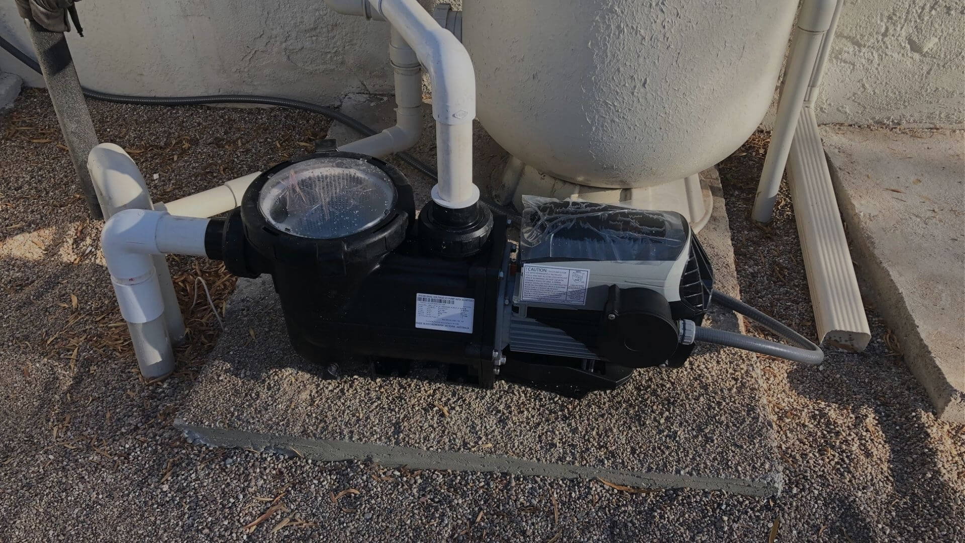 Residential pool pump and filtration system equipment installed beside home in Brentwood CA